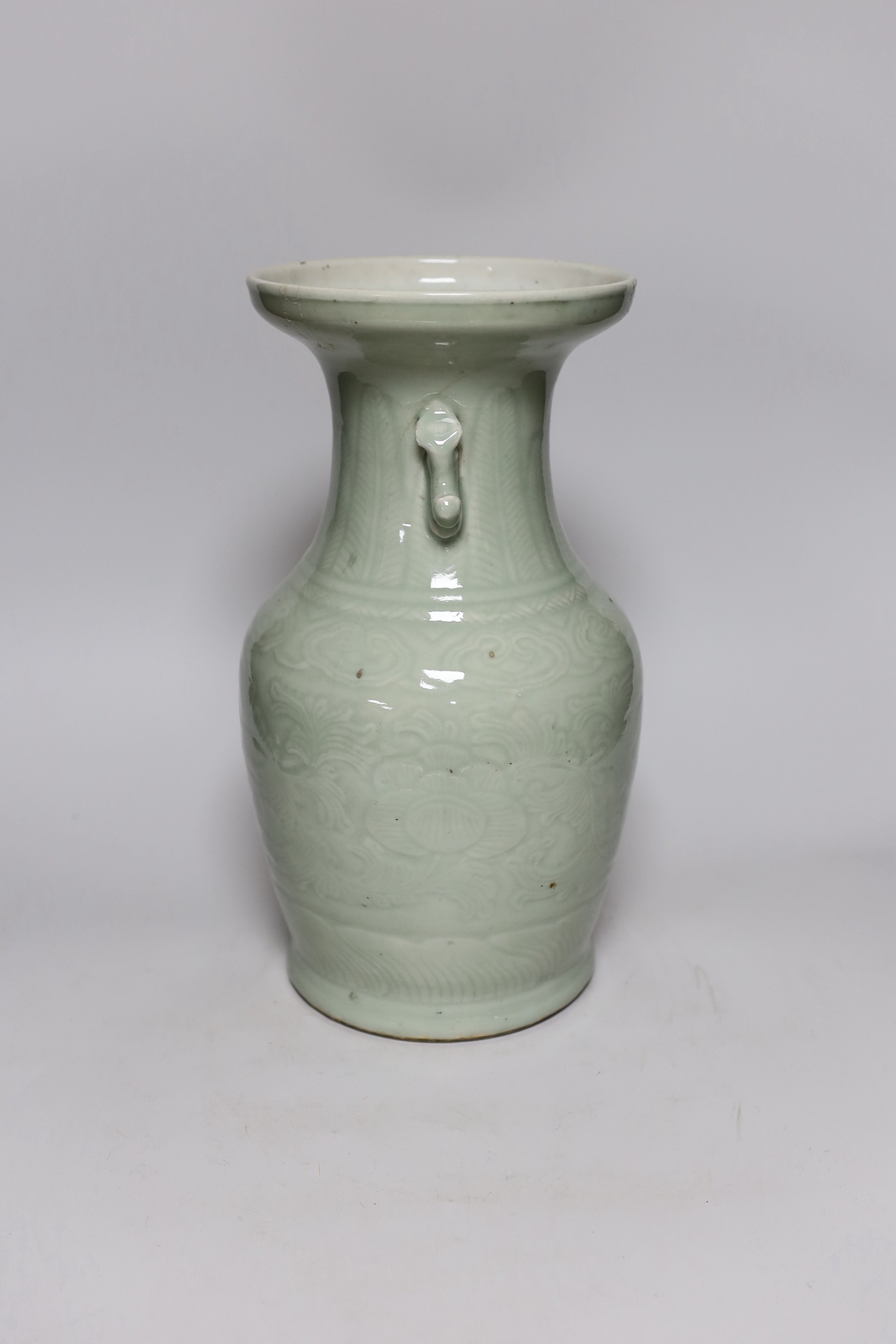 A Chinese celadon glazed vase, 19th century, 33cms high